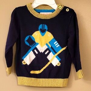 Navy pullover hockey theme knit sweater